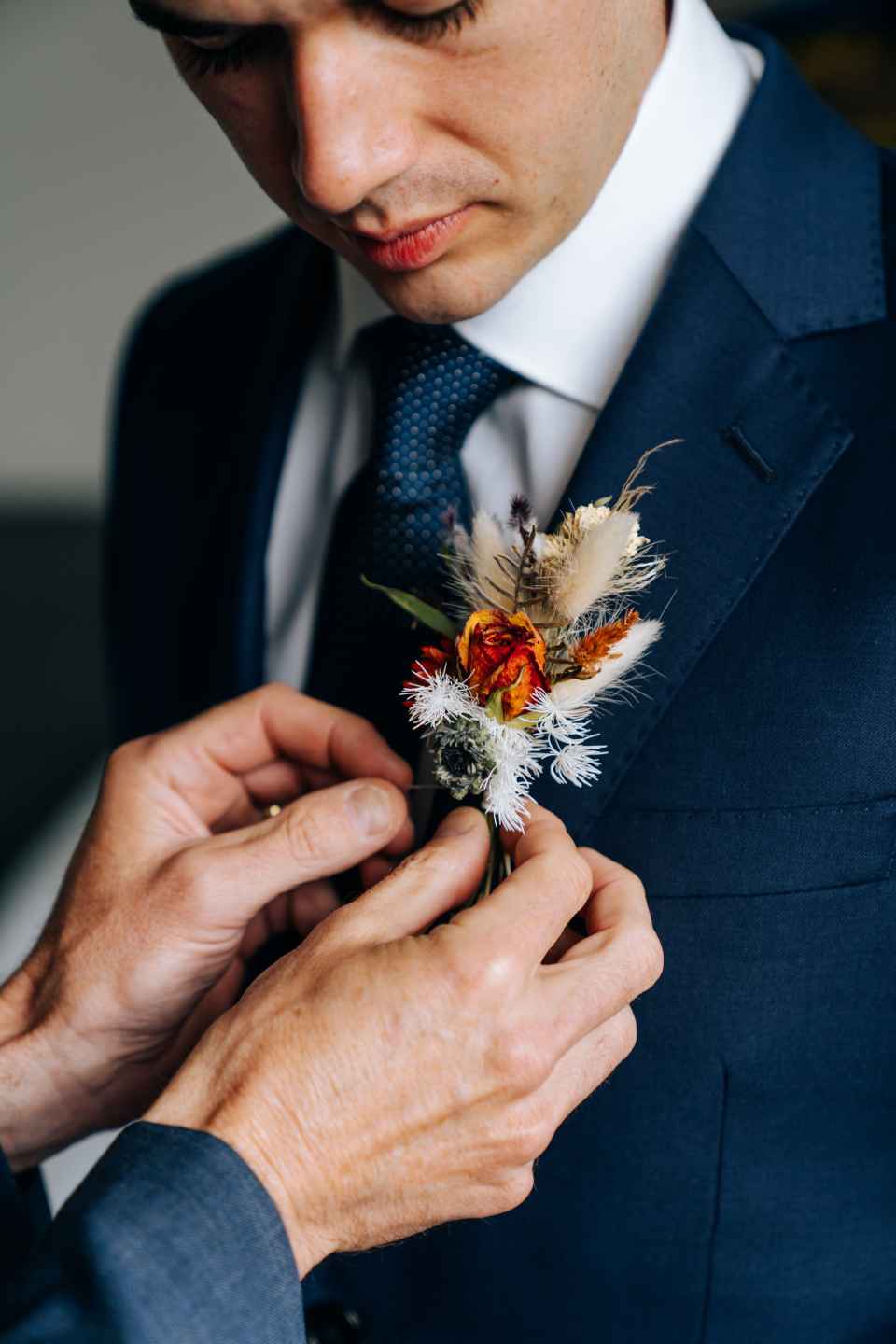 The groom’s family pays for flowers that are used in the bridal bouquet, the groom’s mother's and grandmother's mini bouquets or corsages